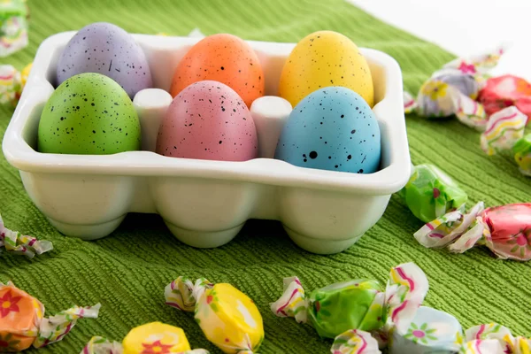 Colored Easter eggs in a white carton — Stock Photo, Image