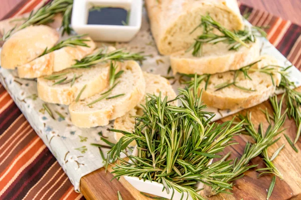 Fresh baked resomary bread loaf and olive oil and balsamic vineg — Stock Photo, Image