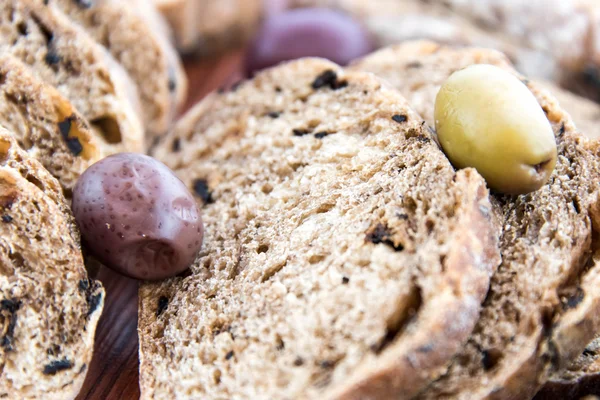 Fresh baked olive bread slices — Stock Photo, Image