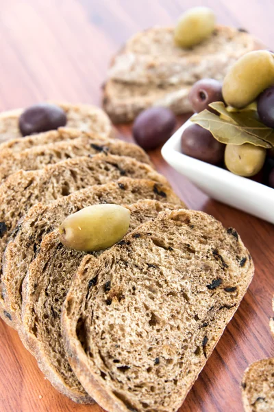 Fresh baked olive bread slices — Stock Photo, Image