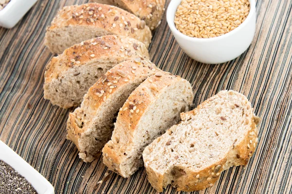 A fresh baked loaf of whole grains bread — Stock Photo, Image