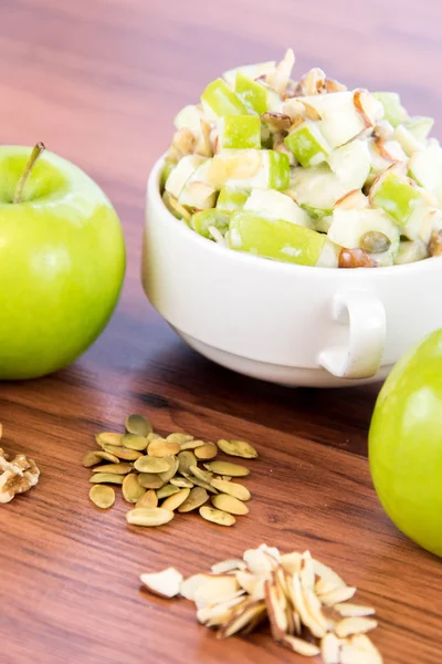 Apple salad with almonds, walnuts and pumpkin seeds — Stock Photo, Image