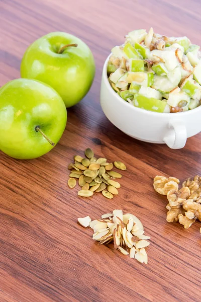 Apple salad with almonds, walnuts and pumpkin seeds — Stock Photo, Image