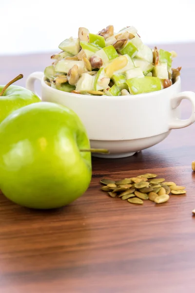 Apple salad with almonds, walnuts and pumpkin seeds — Stock Photo, Image