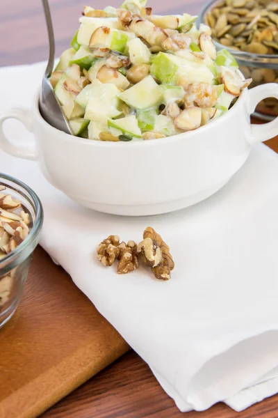 Apple salad with almonds, walnuts and pumpkin seeds — Stock Photo, Image