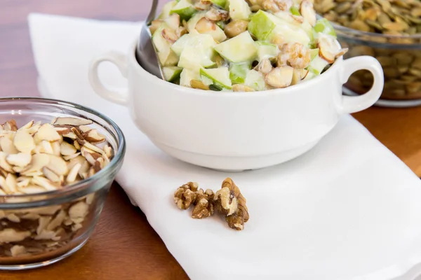 Apple salad with almonds, walnuts and pumpkin seeds — Stock Photo, Image