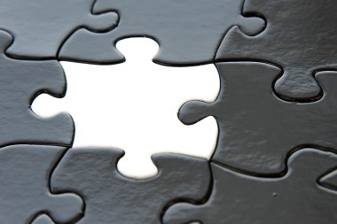 piezas de un rompecabezas blanco y negro