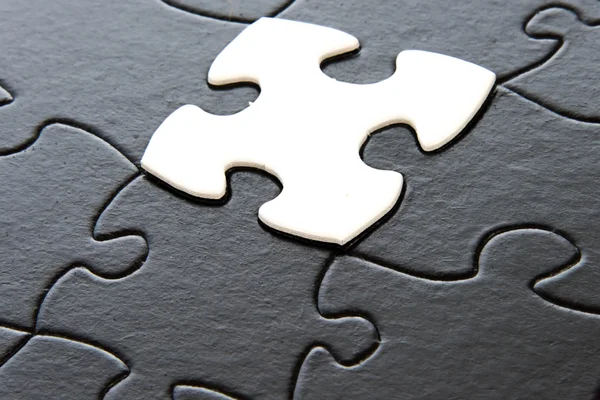 Black and white puzzle pieces — Stock Photo, Image