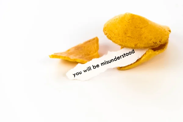 Open fortune cookie - YOU WILL BE MISUNDERSTOOD — Stock Photo, Image