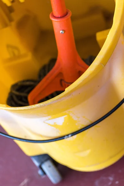 Wet mop in a dry mop bucket — Stock Photo, Image