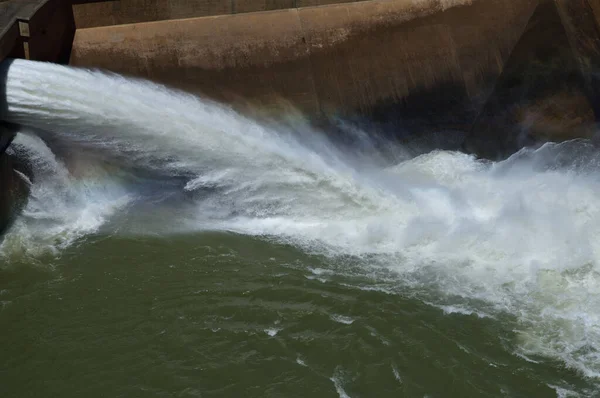 The open sluice of the Gariep dam in South Africa pumping strong — Stock Image Open Sluice Gariep Dam South Africa Pumping Strong Royalty Free Stock Photos