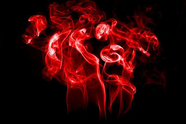 Fire and smoke isolated with light on black background