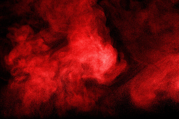 Abstract design of powder cloud against dark background