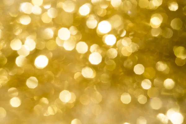 クリスマスの背景とぼやけた b と黄金の抽象的なキラキラ — ストック写真