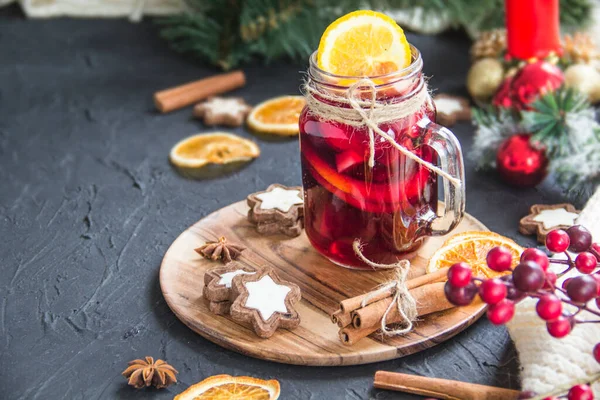 stock image Christmas hot mulled wine with cinnamon cardamom and anise. Dark vintage dirty background. Creative atmospheric decoration