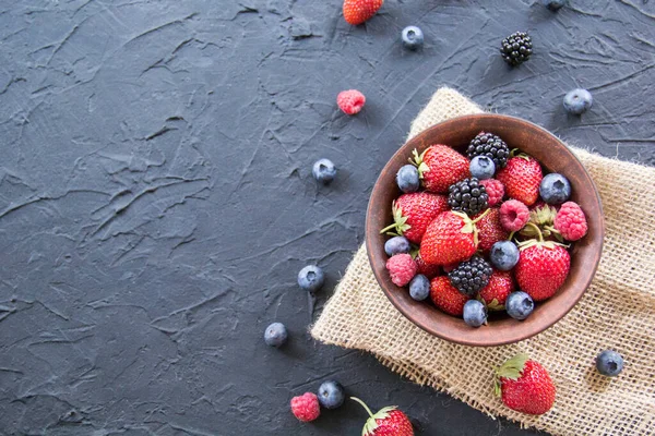 A healthy serving of fresh summer berries. Creative atmospheric decoration