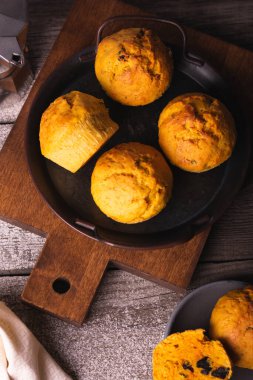 Carrot cupcakes in a plate, top view, vertical orientation