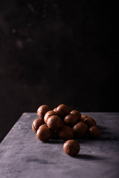 A pile of macadamia nuts on the table