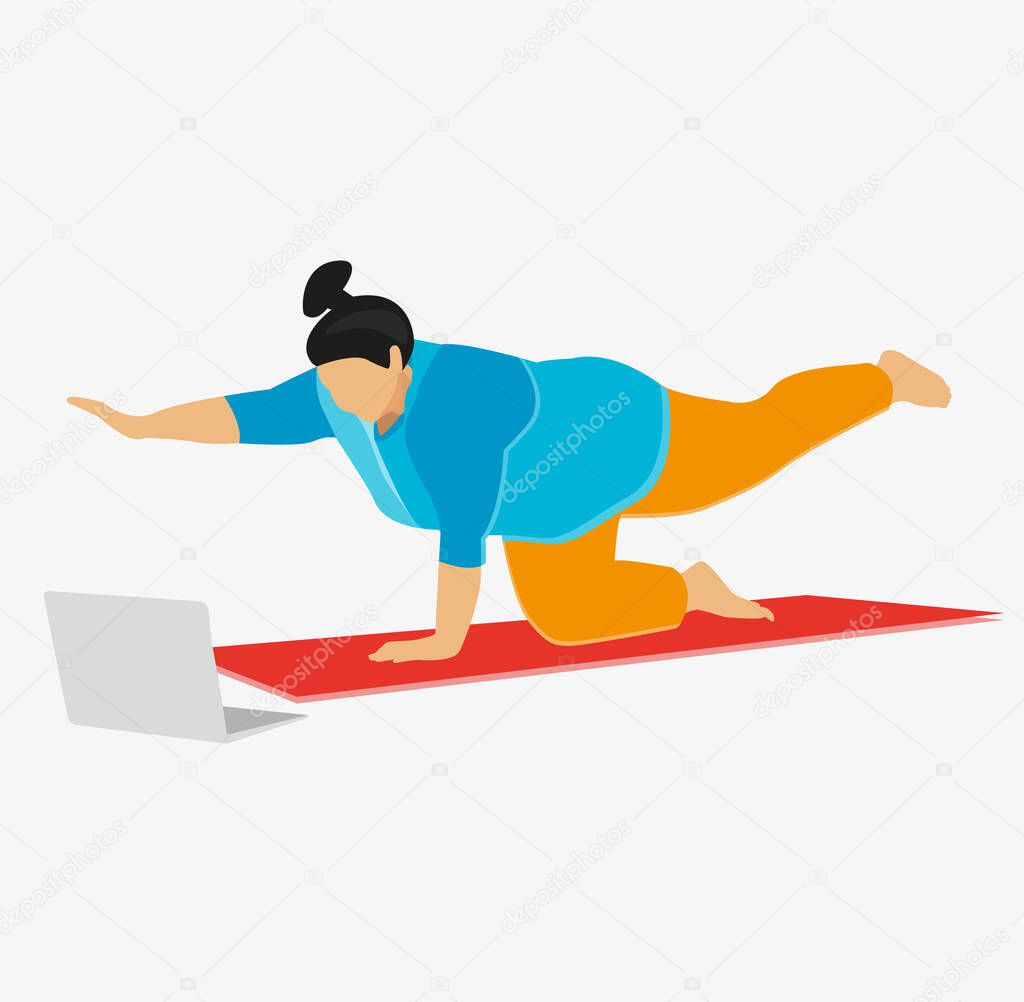 Obese chubby young European female with hair knot practicing yoga or pilates indoors on mat, doing exercises to strengthen core, watching video lesson online in front of open laptop computer on floor