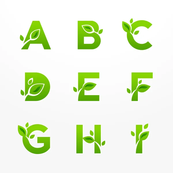 Vector set of green eco letters logo with leaves. Ecological fon — Stock Vector