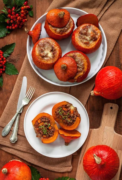 Red kuri squash beef stuffed with vegetables.Red kuri squash  is cultivated variety of the species Cucurbita maxima. It has the appearance of a small pumpkin without the ridges.