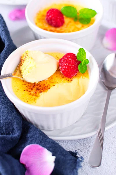 Creme brulee, also known as burned cream, burnt cream or Trinity cream, and similar to crema catalana. It is a dessert consisting of a rich custard base topped with a layer of hardened caramelized sugar.