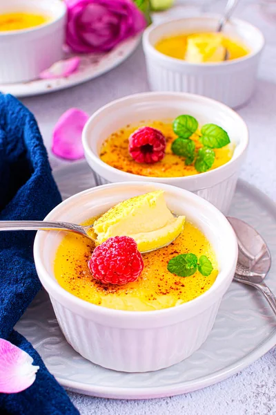 Creme brulee, also known as burned cream, burnt cream or Trinity cream, and similar to crema catalana. It is a dessert consisting of a rich custard base topped with a layer of hardened caramelized sugar.