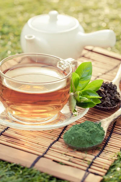 Fresh green tea with tea leaves