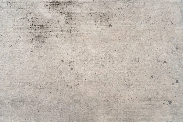 Concrete wall with dirt and moisture stains. Grunge textured background wallpaper.