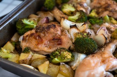 Close-up of delicious baked chicken with vegetables