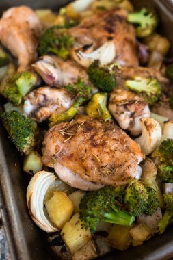 Vertical take on roast chicken with potatoes and broccoli