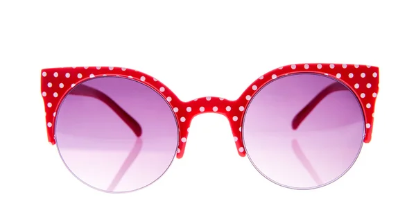 Солнечные очки из красного и белого гороха — стоковое фото