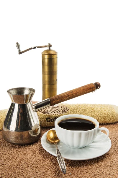 The coffee grinder, coffee pot, cup with black coffee — Stock Photo, Image