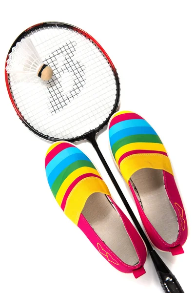 Fashionable, bright, easy sports shoes (gym shoes) with a racket — Stock Photo, Image