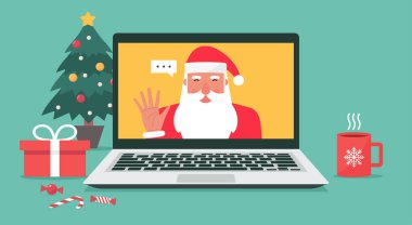 Noel Baba, internetteki Noel ve bayram kutlamaları için dizüstü bilgisayardaki video aracılığıyla selamlaşır. Çizgi film karakteri düz çizer.