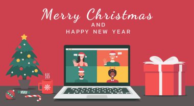 Erkek ve kadın internetten bilgisayar aracılığıyla Noel tatilinde mutlu noeller ve yeni yıl mesajları ve düz çizimler ile sanal tartışmalar yapmak için ofisteki bir bilgisayarda buluşuyorlar.