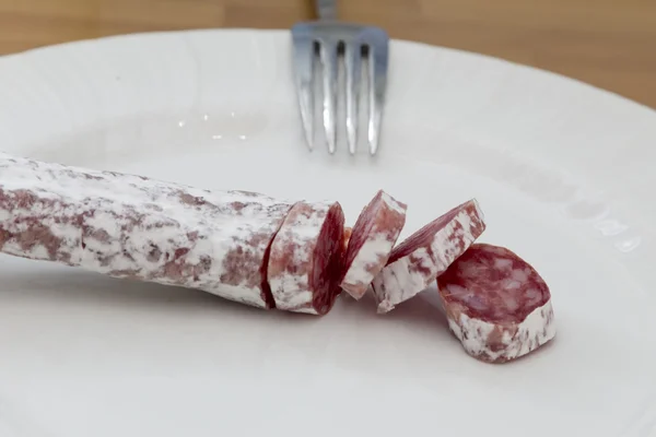 Salami partij en vork — Stockfoto