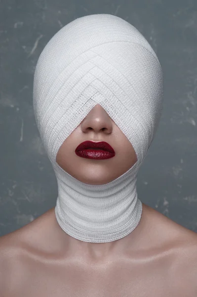Woman with perfect Skin and Bandage on her Head