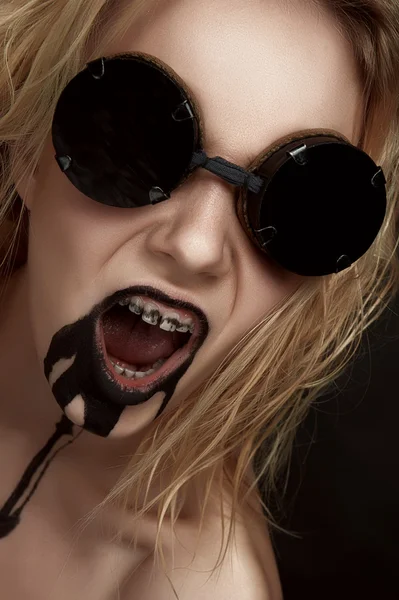 Mad blonde Woman with Black Oil from her Mouth — Stock Photo, Image