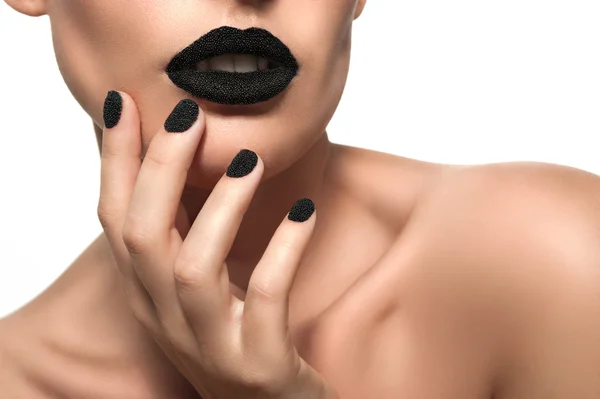 Beautiful female model with black caviar on his lips — Stock Photo, Image