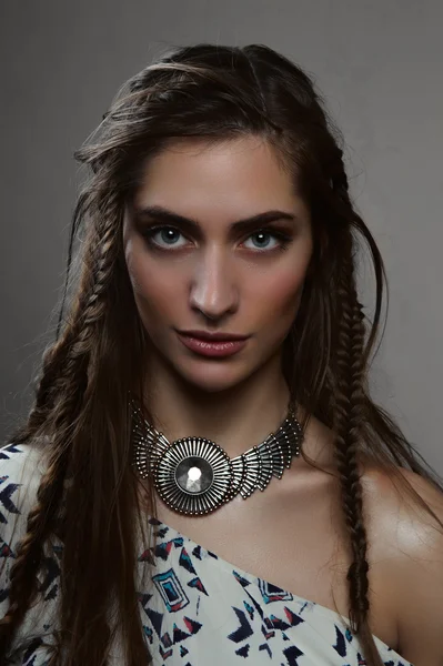 Fashion beauty horsewoman model with brunette braids and pendant — Stock Photo, Image