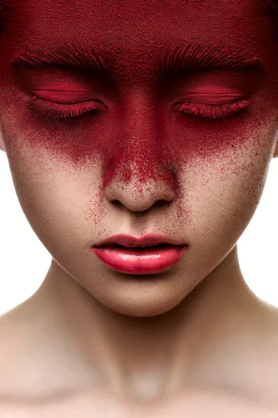 Red paint on face of beauty model — Stock Photo, Image