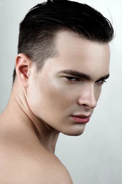 Fashion male model with drops on face — Stock Photo, Image