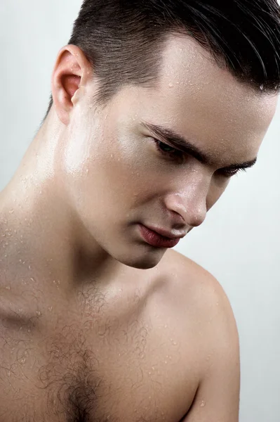 Fashion male model with drops on face — Stock Photo, Image