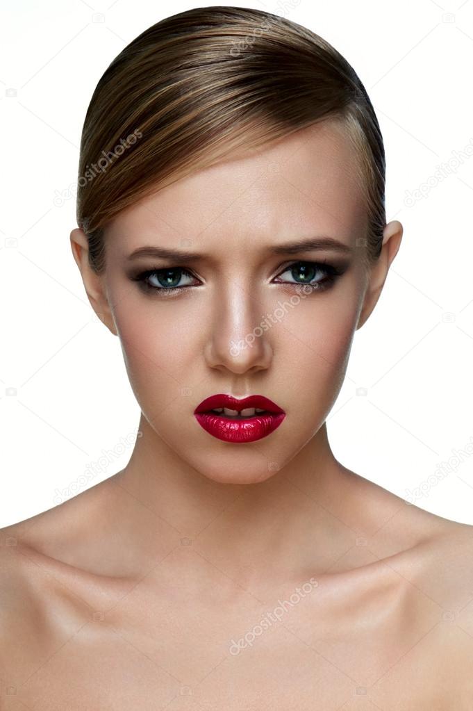 Beauty young female Model with smoky Eyes with negative emotions