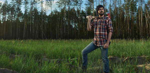 Serious Lumberjack in a Forest — Stock Photo, Image