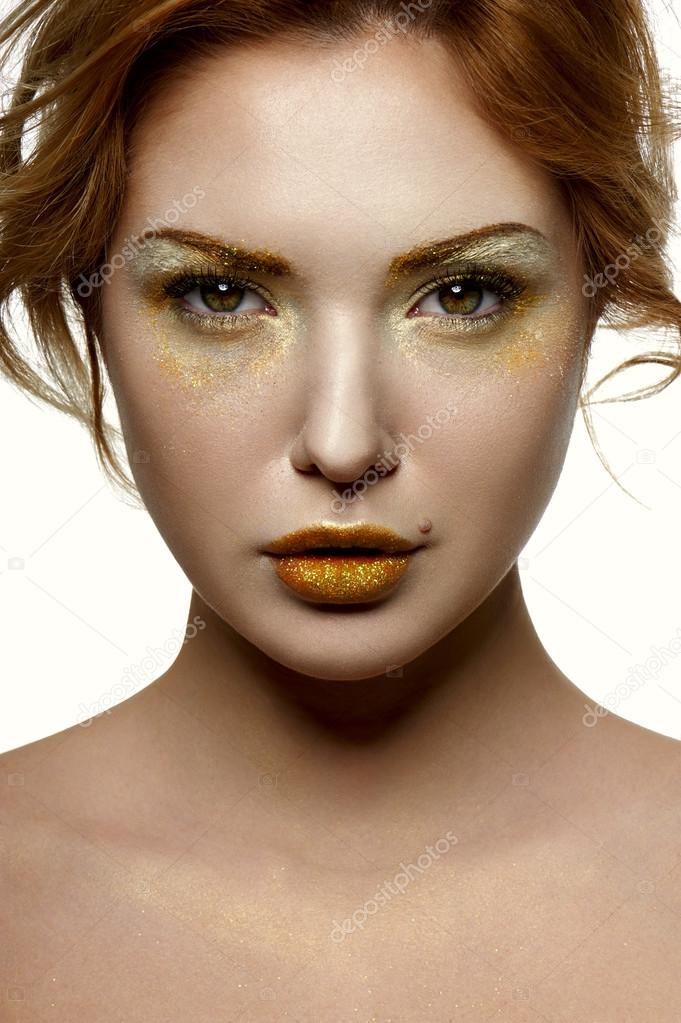 Fashion beauty Female Model with gold Makeup