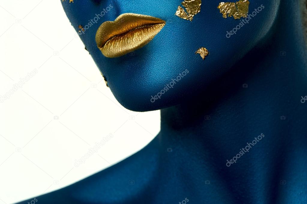 Beauty Model with blue Skin and gold Lips. Halloween Makeup