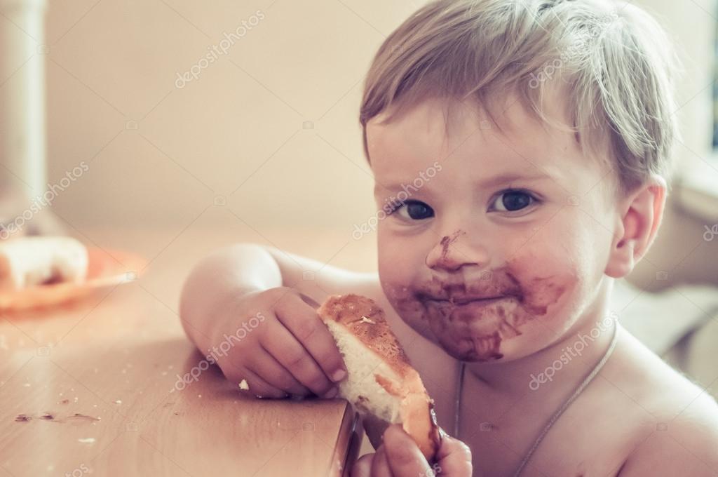 Kid got dirty in chocolate Stock Photo by ©solovei007 105322646