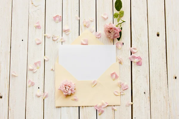 Two envelope with a card inside, old pocket watch and a rose — Stock Photo, Image